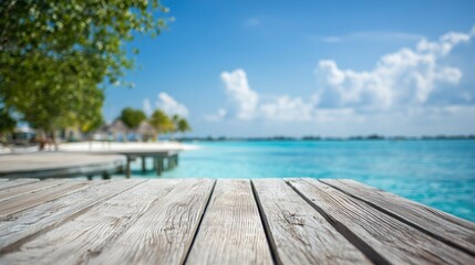 Obraz premium Wooden dock stretching into turquoise waters, serene beach backdrop. Tranquil escape into nature's beauty.