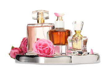 Many different perfume bottles and roses isolated on white