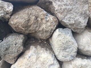 Rough Grey and Brown Stones Texture Close-up of a Stone Wall