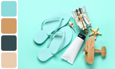 Flip-flops with sunscreen, wooden mannequin with beach chair and airplane on turquoise background....