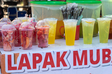 Fresh Fruit Cups and Iced Drinks at a Street Stall
