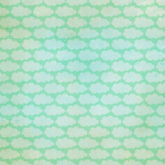 Seamless vintage cloud pattern in soft mint green with textured, distressed effect. Retro sky design ideal for scrapbooking, stationery, wrapping paper, décor, and whimsical graphic projects.