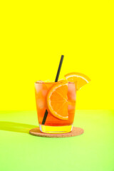 Glass of tasty cold Negroni cocktail on color background