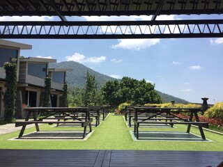 Serene Mountain View from Outdoor Patio with Picnic Tables