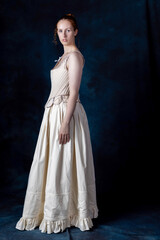 Fototapeta premium A Renaissance or Georgian woman wearing underwear consisting of boned stays and a corded petticoat