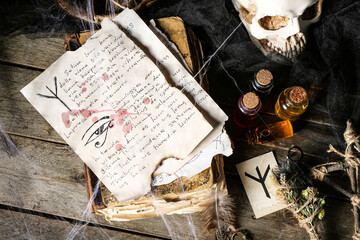 Witch's magic attributes on dark wooden table
