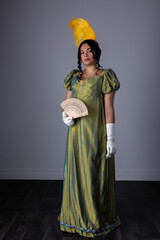 A Regency woman wearing an evening dress with gloves