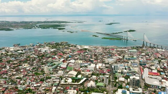 Aerial view of Cebu city with tall buildings. Cebu Cordova Link Expressway. Philippines.