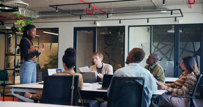 Presentation, business woman and leader in meeting with brand strategist for idea in startup office. Speaker, team and discussion for brainstorming creative project, campaign proposal and planning