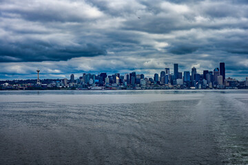 2025-06-04 VIEW OF THE SEATTLE SKYLINE AND PUGET SOUND WITH STORMY CLOUDS FROM BAINBRIDGE ISLAND WASHINGTON