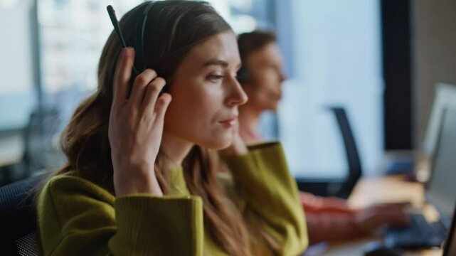 Closeup hand grabbing headset communication at workplace. Specialist assisting