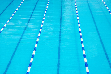 The blue and white pool is empty