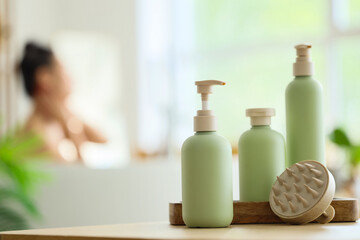 Shampoo, shower gel, soap and scalp massage brush in bathroom