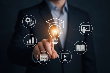 Professional Hand Activating a Glowing Lightbulb with Graduation Cap Icon, Surrounded by Diverse Learning and Business Resource Icons on a Dark Background