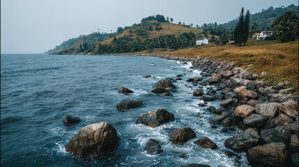 Coastal scenery with rocks and ocean waves.