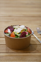 Fresh salad bowl with assorted vegetables and toppings