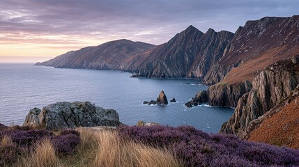 Dramatic coastal landscape with rugged cliffs and a tranquil sea.