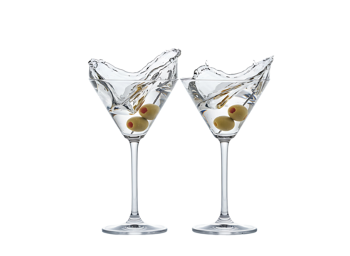 Two martini glasses with olives and splash isolated on transparent background