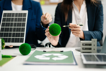 Group of alternative energy engineers discussing a project with a worker businesspeople a meeting in solar