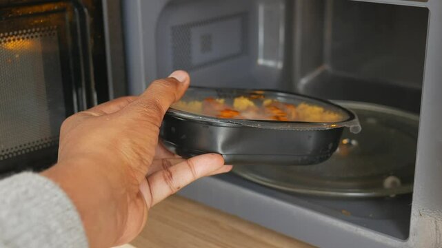 Heating up a meal in the microwave for a quick dinner