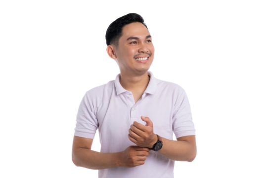 Smiling young Asian man in white polo shirt looking away while adjusting wristwatch isolated on transparent background