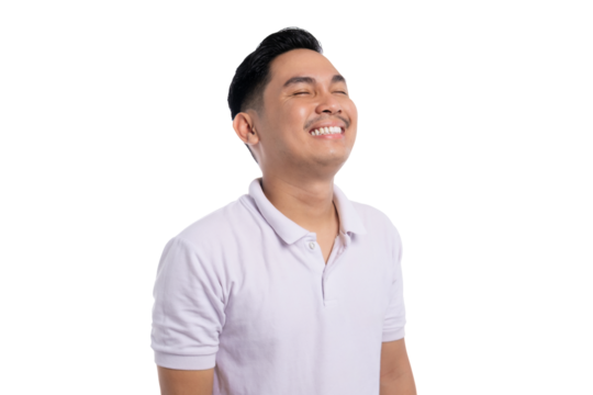 Happy young Asian man in white polo shirt smiling with eyes closed looking up isolated on transparent background - Powered by Adobe