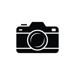Black Silhouette of a Camera Icon with Visible Lens on a White Background