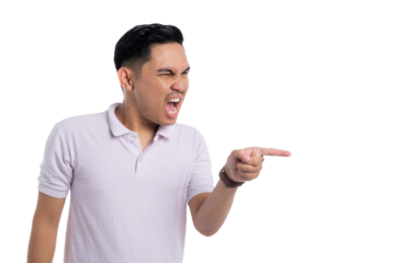 Angry young Asian man yelling and pointing finger aggressively to the side isolated on transparent background