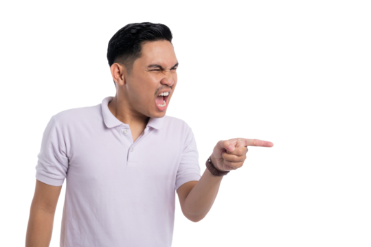 Angry young Asian man yelling and pointing finger aggressively to the side isolated on transparent background