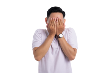 Embarrassed young Asian man covering his face with both hands isolated on transparent background