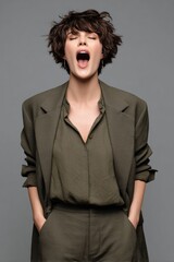 A woman expressing emotion with a yawn, showcasing a relaxed yet fashionable style.