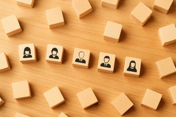 Wooden Blocks with Diverse Human Silhouettes Representing Teamwork, Collaboration, Communication, and Unity on a Wooden Surface