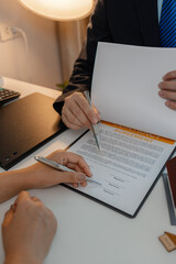 staff is explaining the information about the house lease contract documents to the buyer, the...