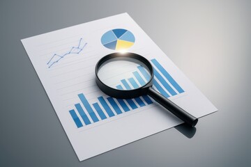Magnifying Glass on Business Report Featuring Graphs and Charts Illustrating Financial Analysis and Data Insights for Professional Review