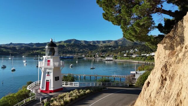 Scenic Drone View of Akaroa Harbor and Lighthouse