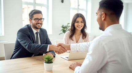 Smiling lawyer, realtor or financial advisor handshaking young couple thanking for advice, insurance broker or bank worker and millennial customers shake hands making deal, investment or taking loan