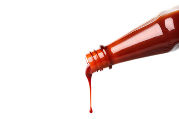 Red sauce pouring from bottle isolated on a white background