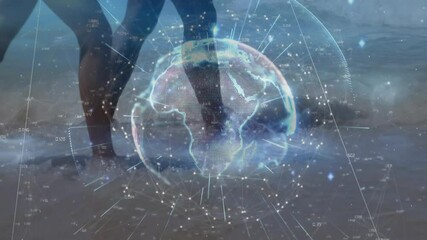 Couple walking through shallow water and activating rotating digital globe for data visualization - Powered by Adobe