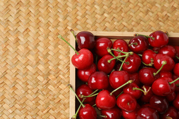 cherries on a wooden table in a container