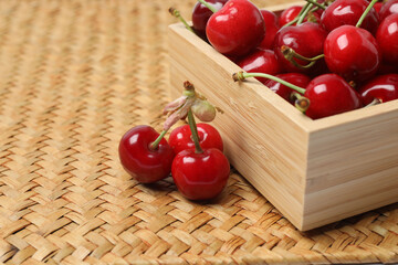 cherries on a wooden table in a container
