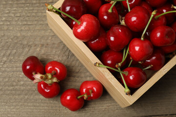cherries on a wooden table in a container
