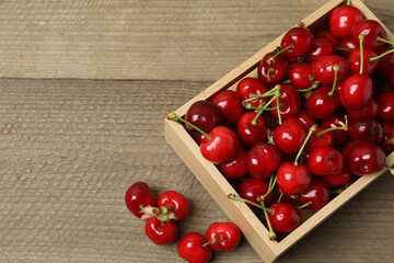cherries on a wooden table in a container