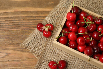 cherries on a wooden table in a container