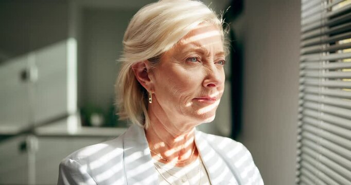 Mature, woman in business and thinking by window with corporate vision, ideas or mindset for legal case. Lawyer, attorney or advocate with insight, decision or reflection for judicial verdict