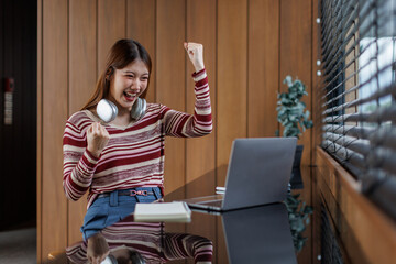Successful caucasian happy young woman student freelancer using laptop, watching webinars, working...