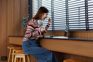 Successful caucasian happy young woman student freelancer using laptop, watching webinars, working...