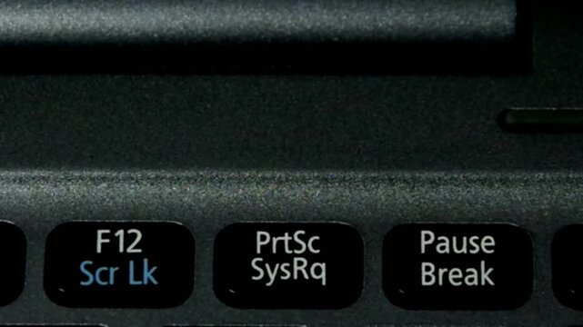 Close-up of Laptop Keyboard Function Keys F12, Print Screen, Pause/Break
