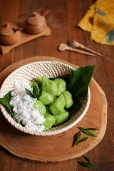 Glutinous rice balls with coconut grated or klepon in a bowl