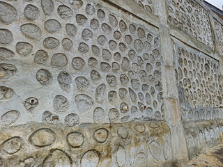 The retaining wall is made of natural stone to prevent landslides.