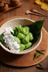 Glutinous rice balls with coconut grated or klepon in a bowl